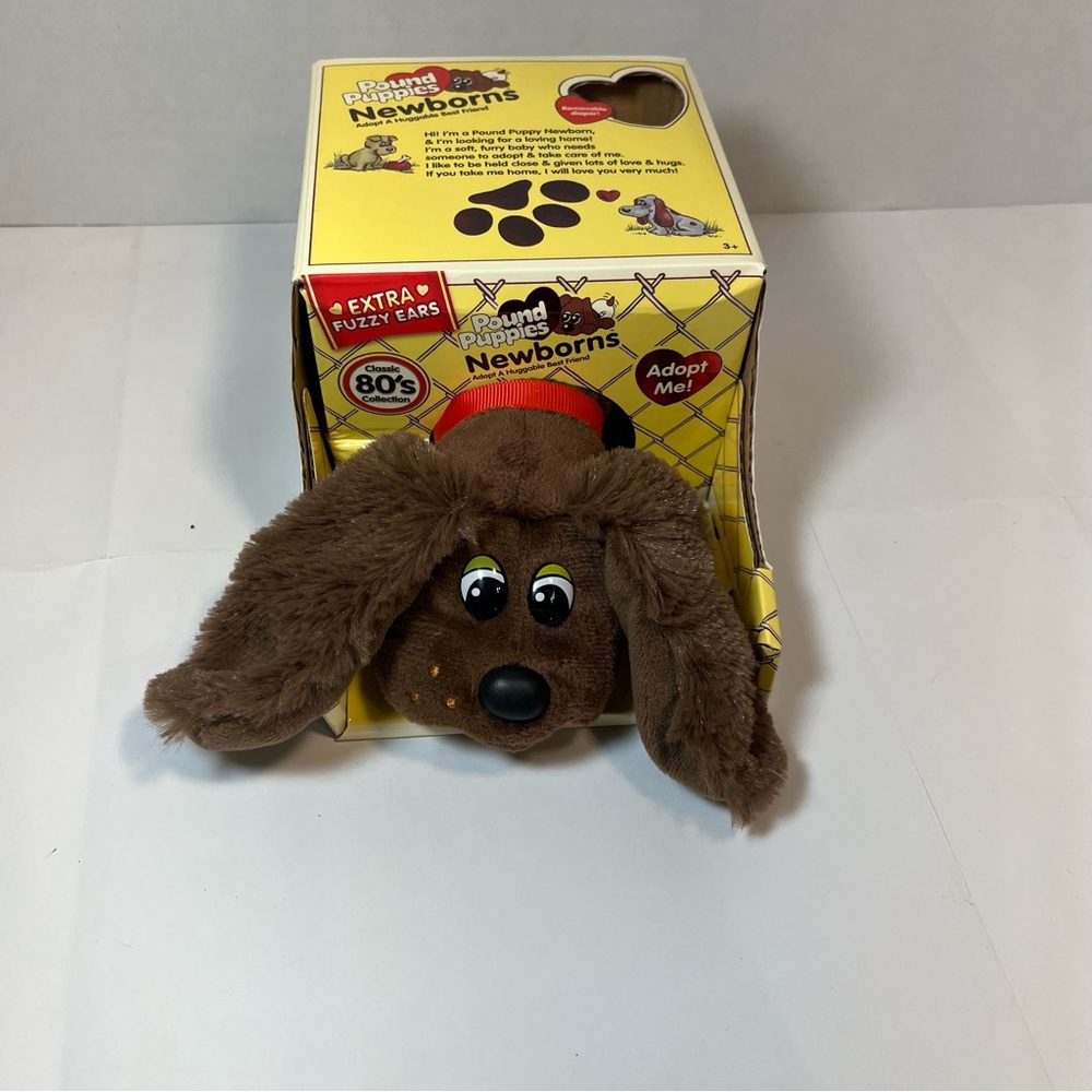Hasbro, brown Pound Puppies, newborn, plush toy with extra fuzzy ears.